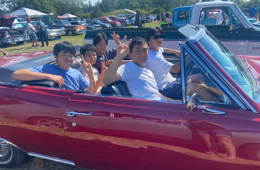 ESL Students enjoying their time in a convertable car